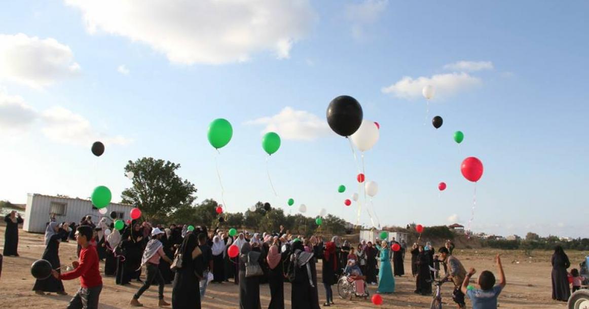 فعالية إطلاق البلالين بألوان علم فلسطين بمخيم العودة شرق البريج