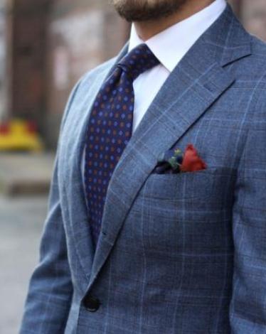 patterned-suit-with-white-shirt-and-blue-floral-tie