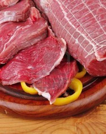 9435352-red-meat-on-wooden-table-ready-to-cook
