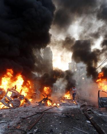 Flames-rise-from-burning-cars-at-the-site-of-a-car-bomb-that-targeted-Beiruts-southern-suburb-of-Haret-Hreik-on-January-2-2014