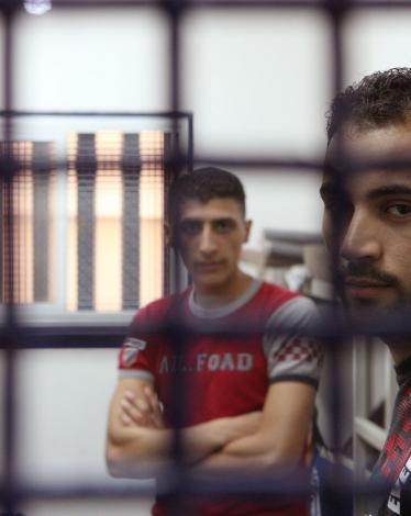 Palestinan-prisoners-wait-for-their-turn-inside-a-cell