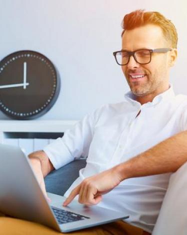 casual-man-relaxing-using-laptop-stock-photo-04