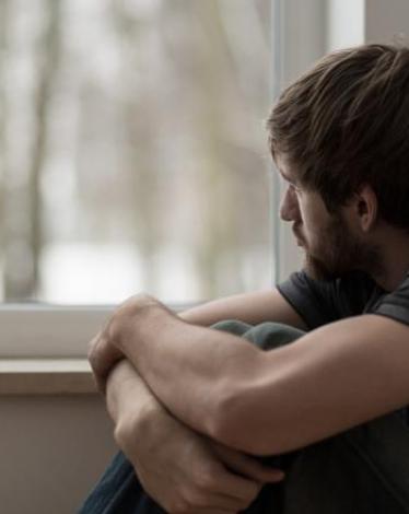 young-man-suffering-from-depression-ts-486748776