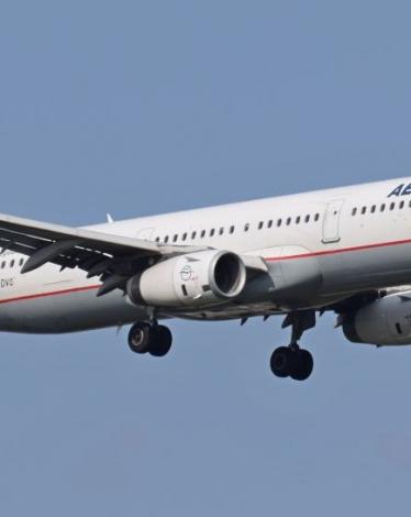 Aegean_Airbus_A321_SX-DVO_arrives_London_Heathrow_Airport_21Sept2014_arp-e1434934823606