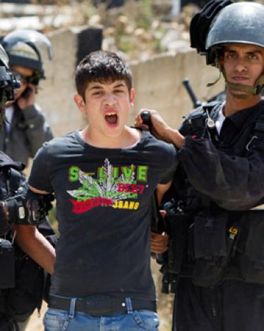 Palestinian-youth-arrested-by-Israeli-soldiers-in-Beit-Hanina