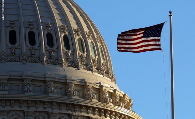 The last rays of sunlight fall on the dome of the U.S. Capitol 