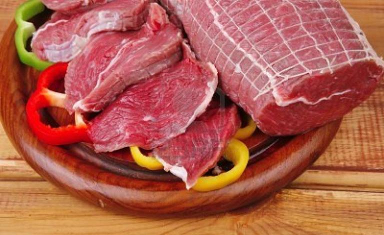 9435352-red-meat-on-wooden-table-ready-to-cook