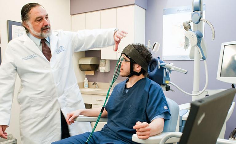 Transcranial-magnetic-stimulation-is-used-to-monitor-activity-in-the-prefrontal-lobe-of-the-brain