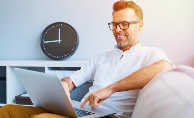 casual-man-relaxing-using-laptop-stock-photo-04