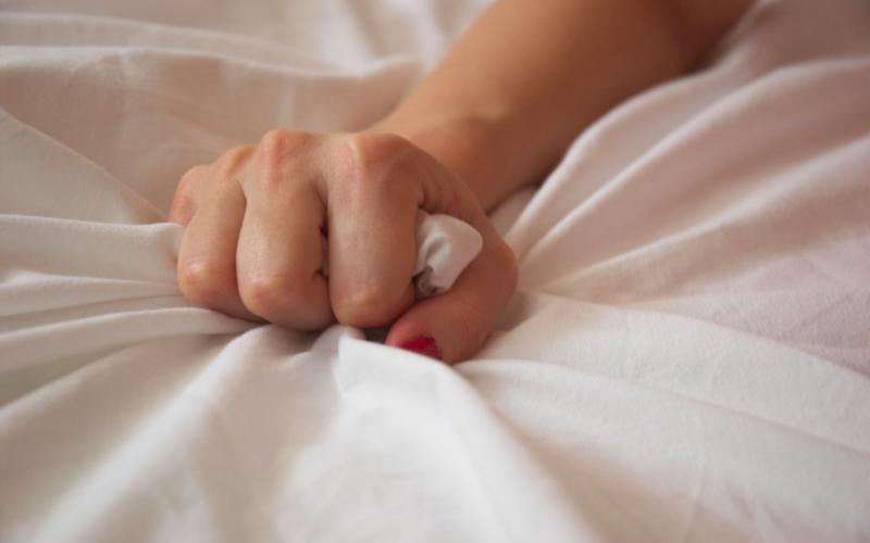 hand-grasping-sheet