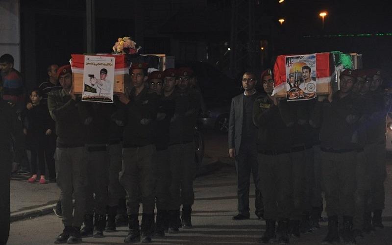 بالصور: تسليم جثماني الشهيدين "جرادات وبشارات"