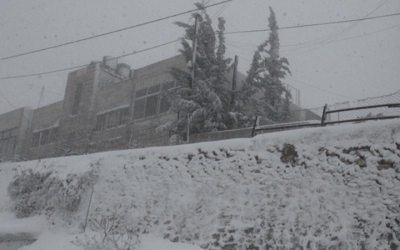 صور: الخليل تكتسي بالثوب الأبيض
