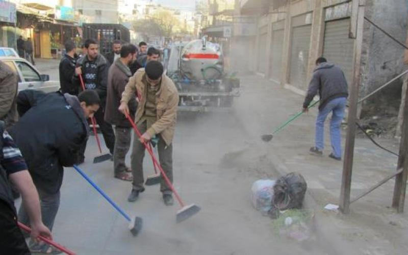 بالصور: حماس تنفذ حملة تطوعية للنظافة بالشجاعية
