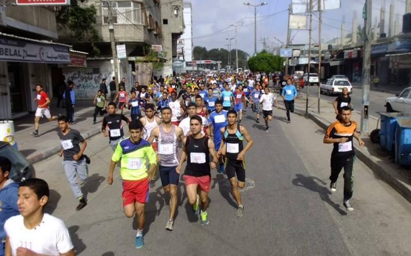 بالصور: حماس تنظم سباق الضاحية بخانيونس
