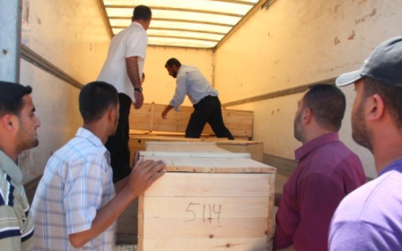 بالصور..وصول جثامين 11 شهيد إلى قطاع غزة