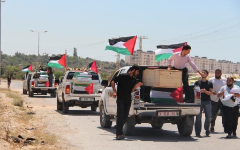 بالصور..وصول جثامين 11 شهيد إلى قطاع غزة