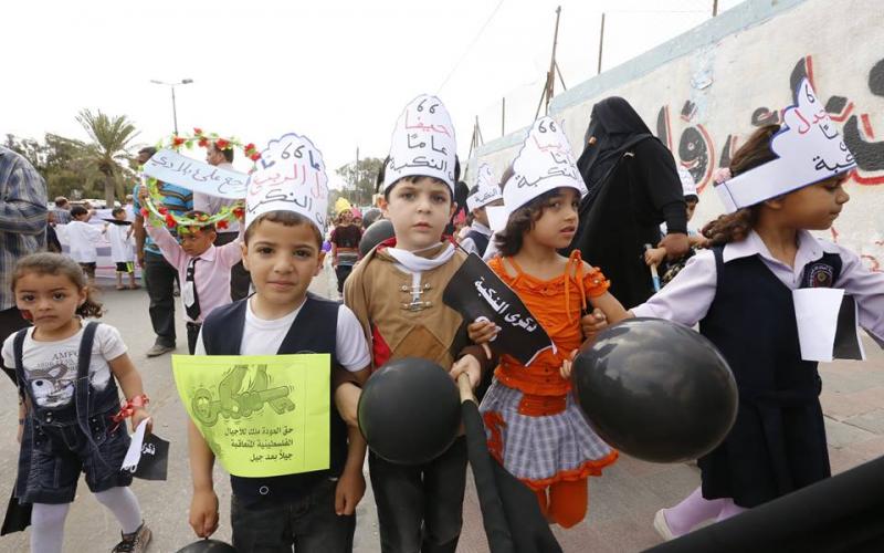 بالصور: أطفال خانيونس يحيون ذكرى النكبة