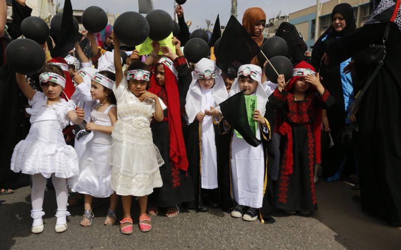 بالصور: أطفال خانيونس يحيون ذكرى النكبة