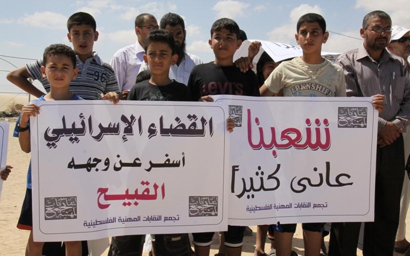 بالصور..وقفة احتجاج ضد تبرئة قتلة كوري برفح