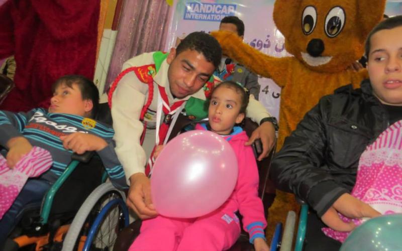 صور:كشافة البريج تشارك باليوم العالمي للمعاق