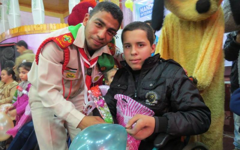 صور:كشافة البريج تشارك باليوم العالمي للمعاق