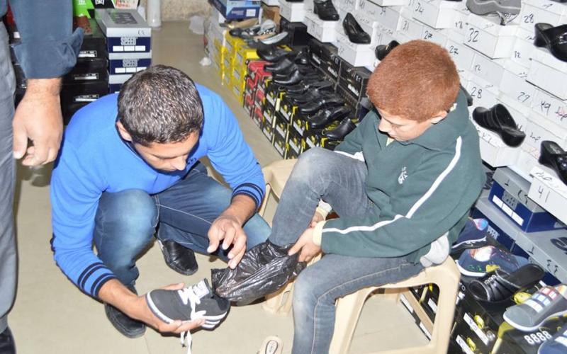 دار القرآن بالمغازي توزع كسوة الشتاء