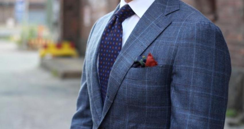 patterned-suit-with-white-shirt-and-blue-floral-tie