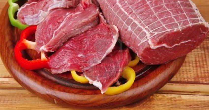 9435352-red-meat-on-wooden-table-ready-to-cook