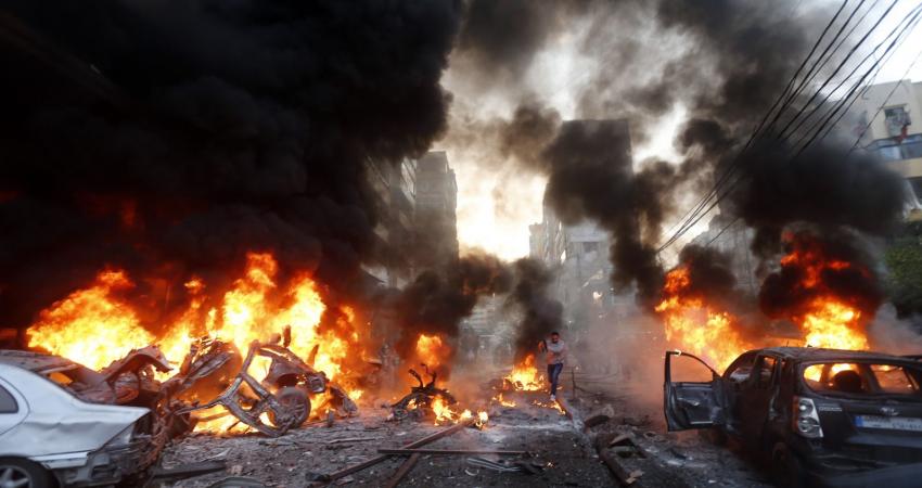 Flames-rise-from-burning-cars-at-the-site-of-a-car-bomb-that-targeted-Beiruts-southern-suburb-of-Haret-Hreik-on-January-2-2014