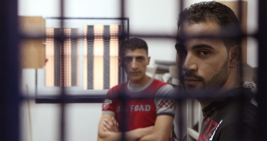 Palestinan-prisoners-wait-for-their-turn-inside-a-cell