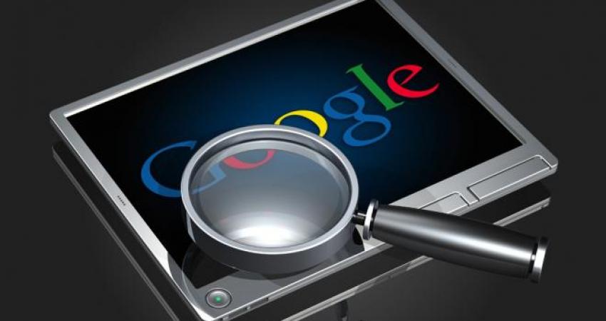 magnifying-glass-hovering-over-google-logo-displayed-on-a-tablet-device