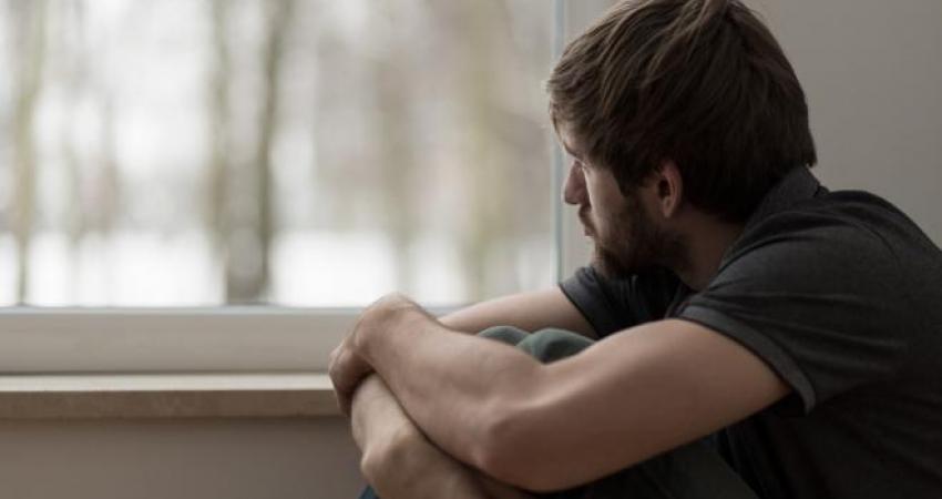 young-man-suffering-from-depression-ts-486748776