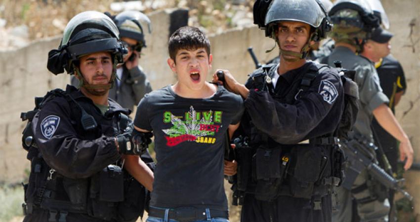 Palestinian-youth-arrested-by-Israeli-soldiers-in-Beit-Hanina