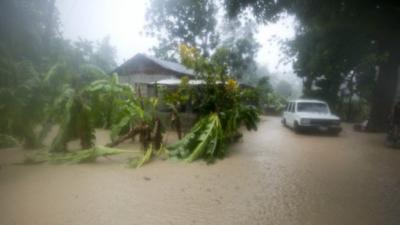 161005073222_a_vehicles_sits_next_to_a_house_stranded_in_the_flood_waters_caused_by_hurricane_matthew_in_leogane_haiti__512x288_ap_nocredit