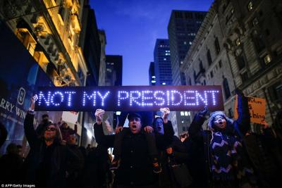 3B569F9000000578-4029044-Demonstrators_protest_against_US_President_elect_Donald_Trump_in-a-66_1481661482355_935964